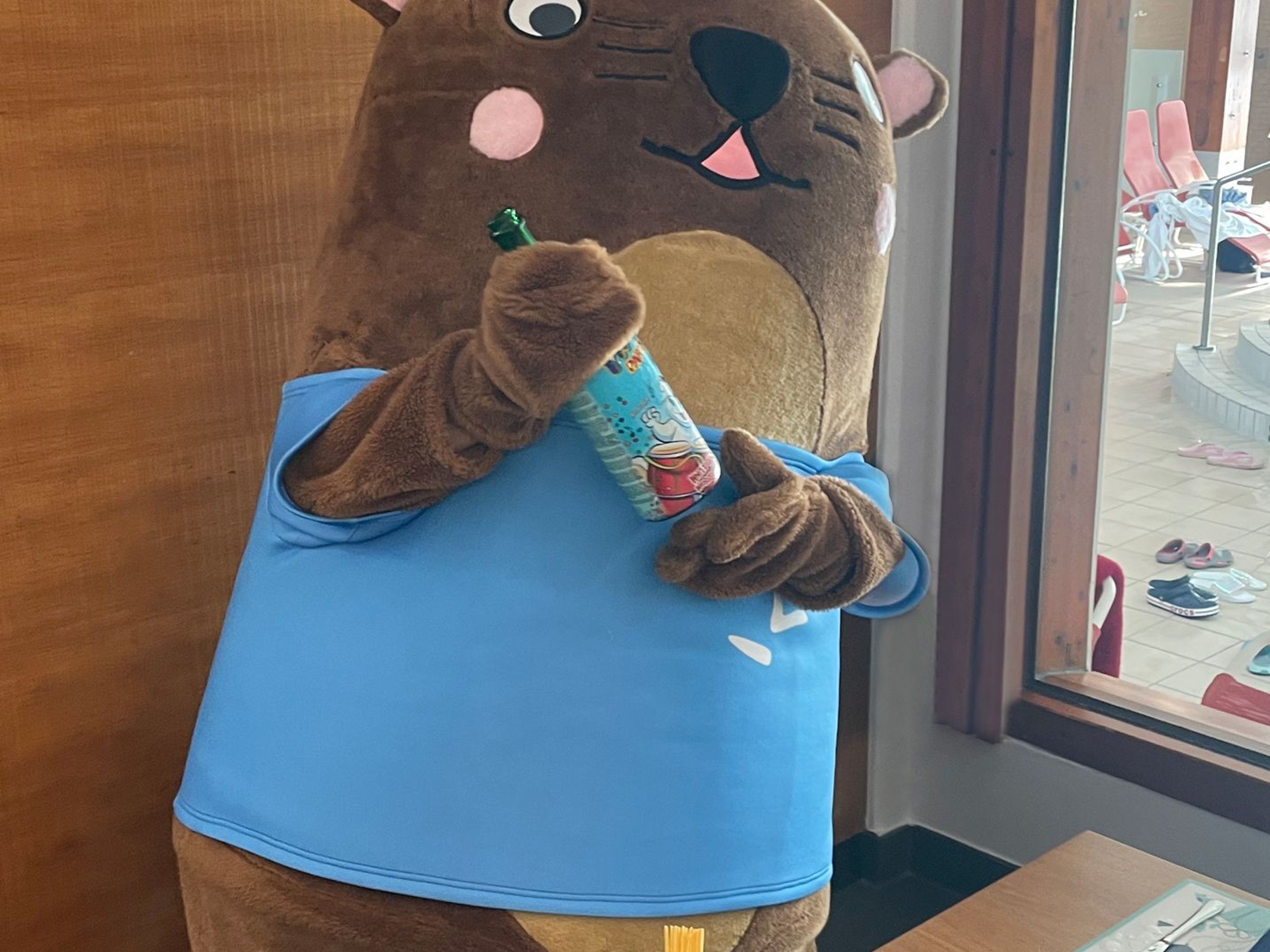 Otto with a non-alcoholic bottle of sparkling wine