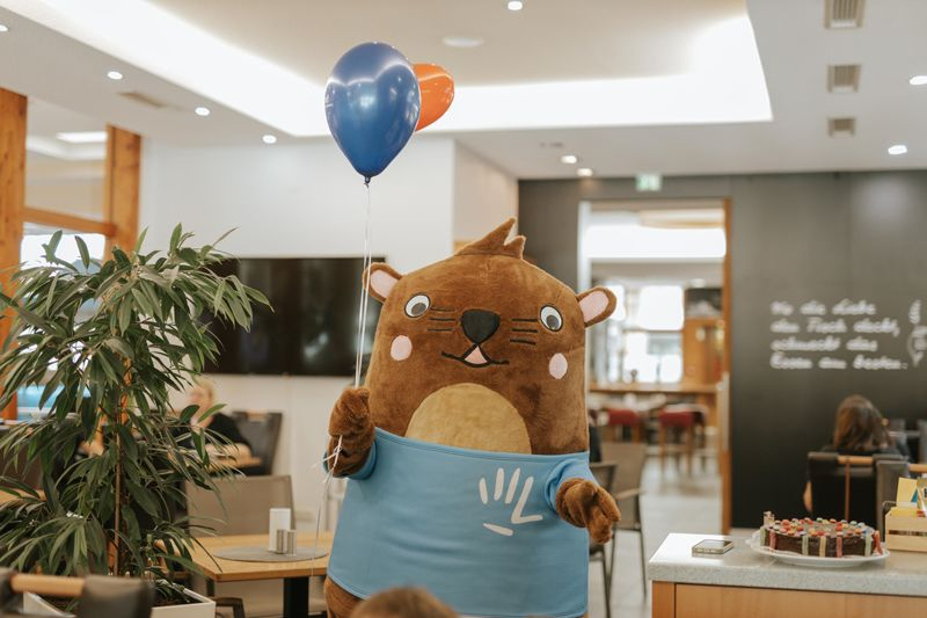 Otto arrives for his VIP visit with balloons in his hands.