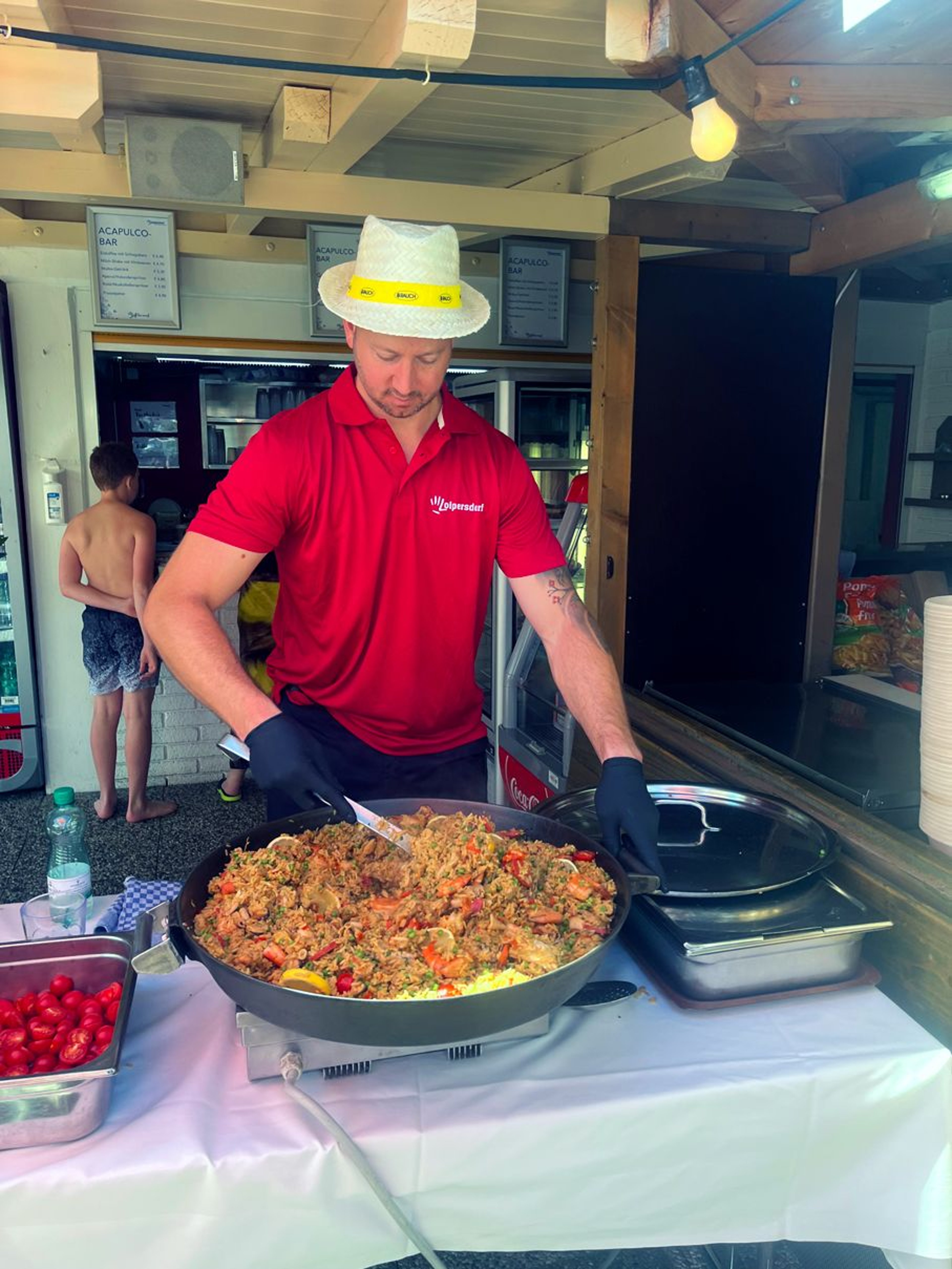 Chef cooks paella