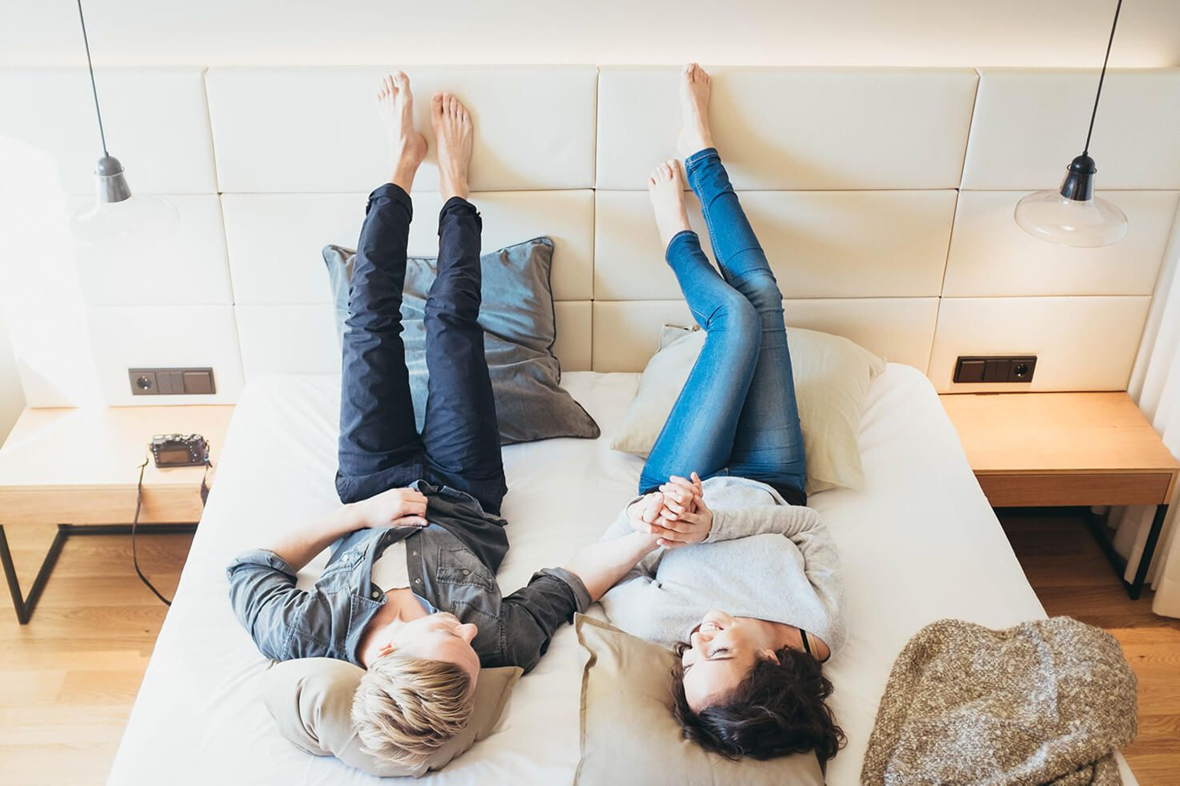 A couple relaxing in a double room at the Hotel Kowald next to the Loipersdorf thermal spa resort.