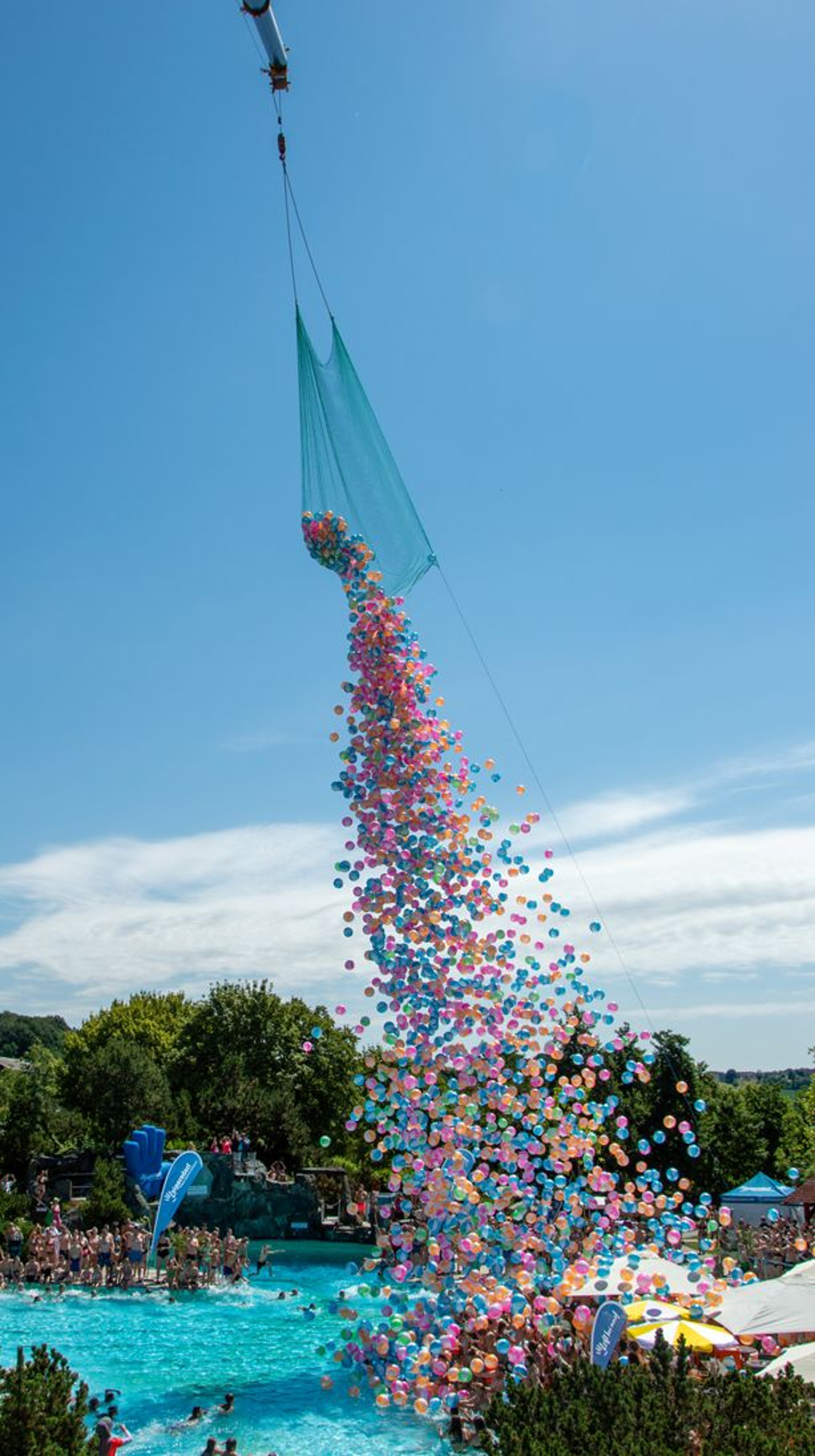 Lots of beach balls raining from the sky