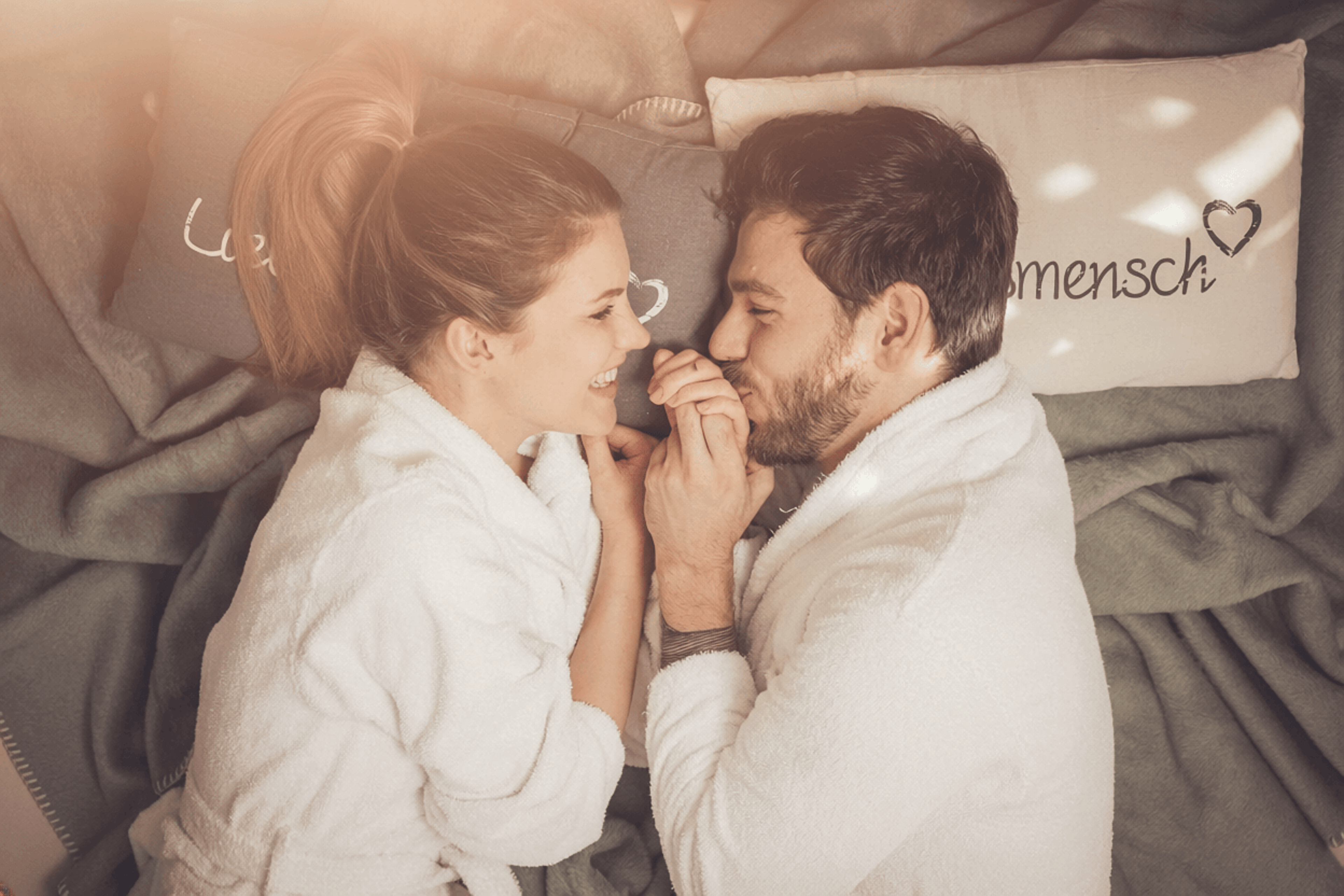 The man in love kisses the woman on the hand.