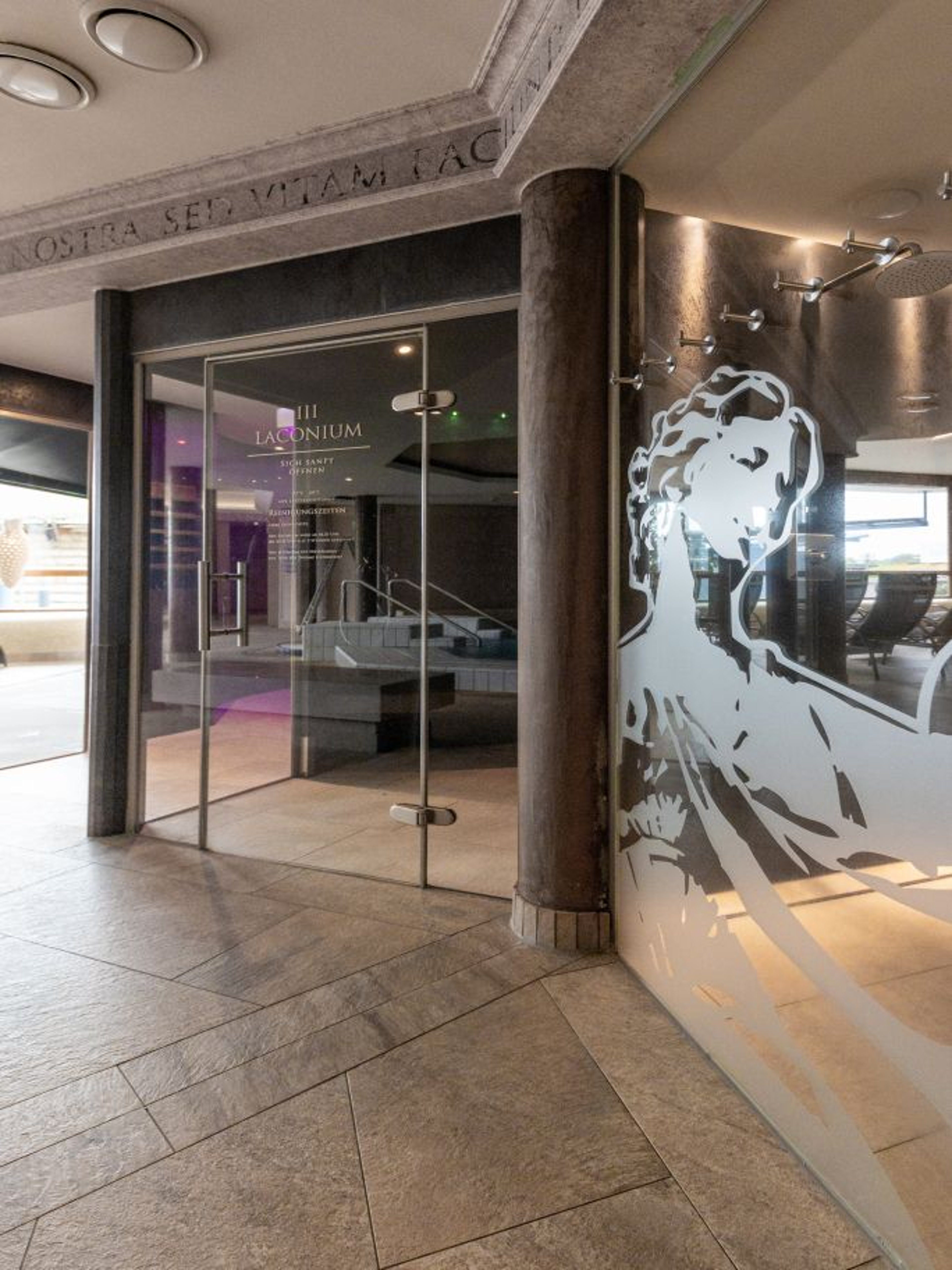 The glass doors of the Laconium provide an insight into the sauna.