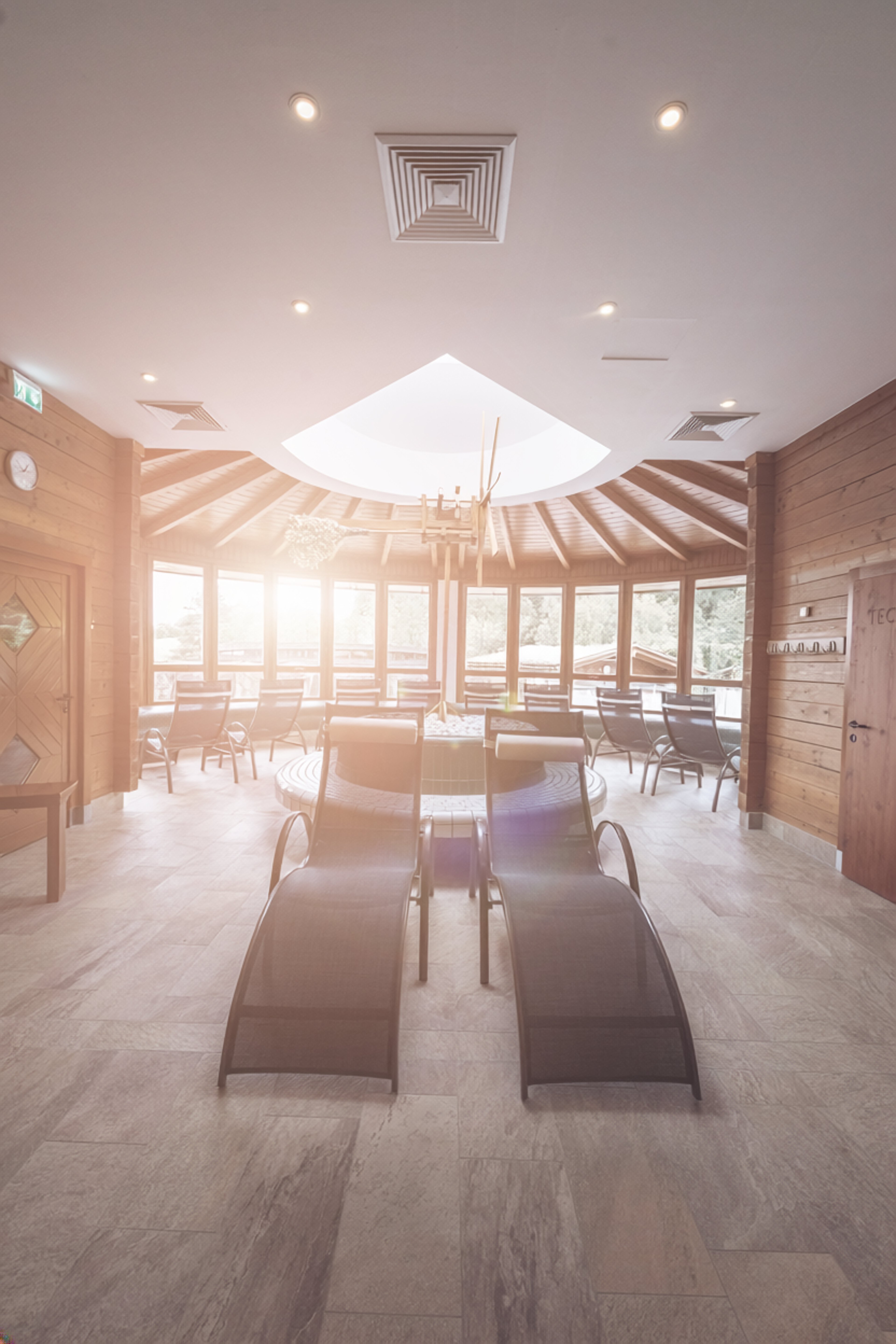 Sun loungers in the Styrian area with a wind turbine 