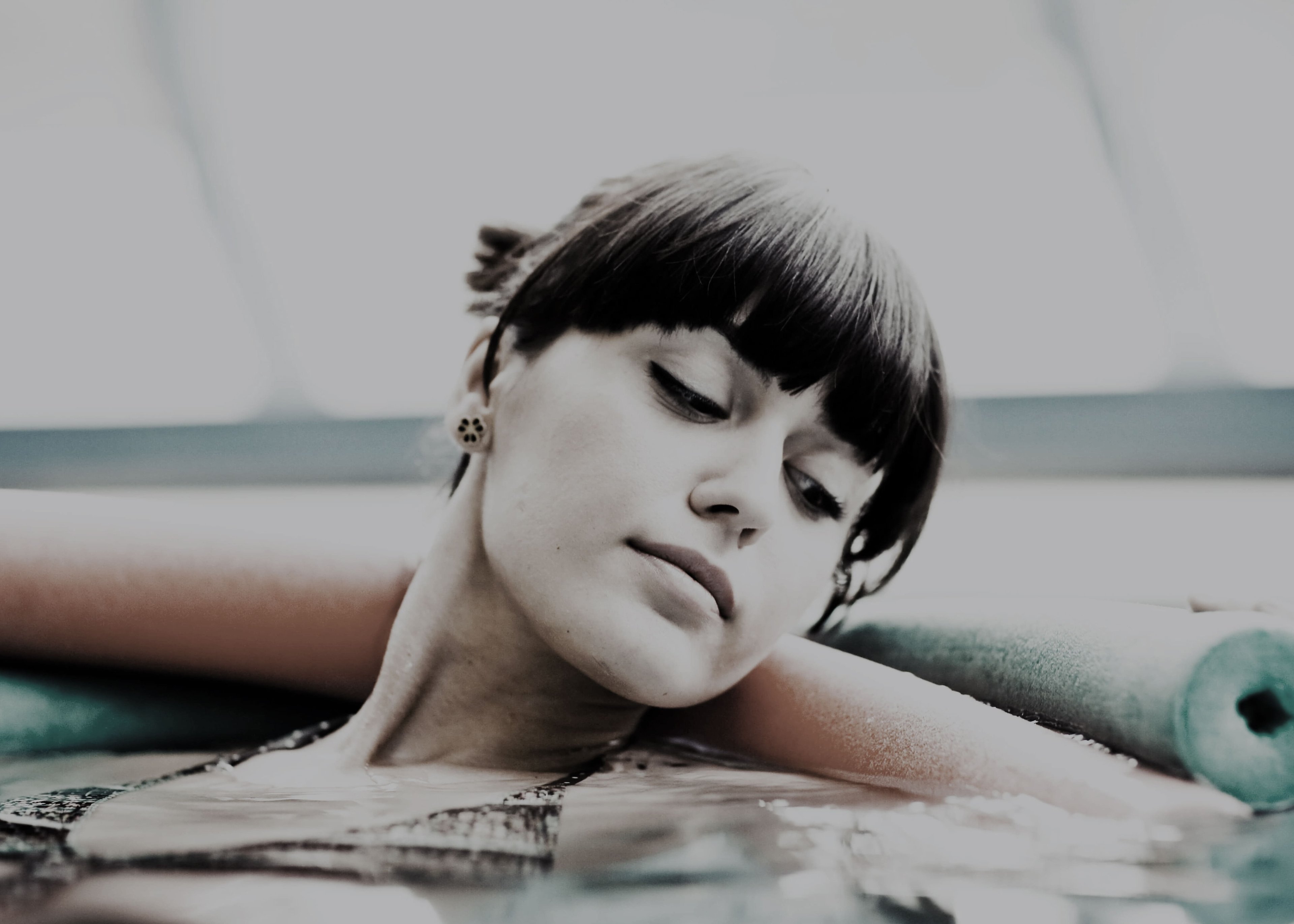 Woman doing gymnastics in the thermal pool.