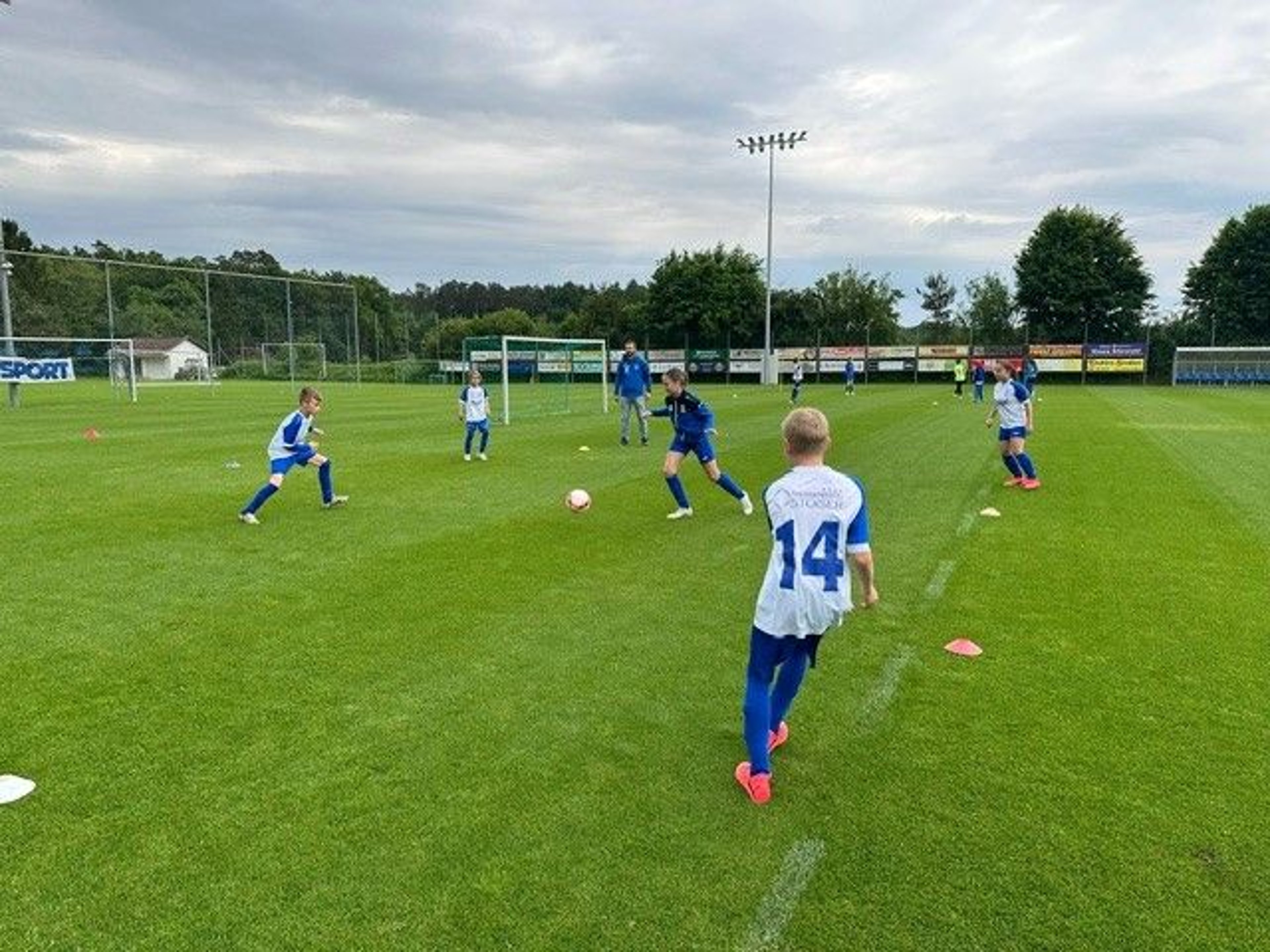 Children play soccer.