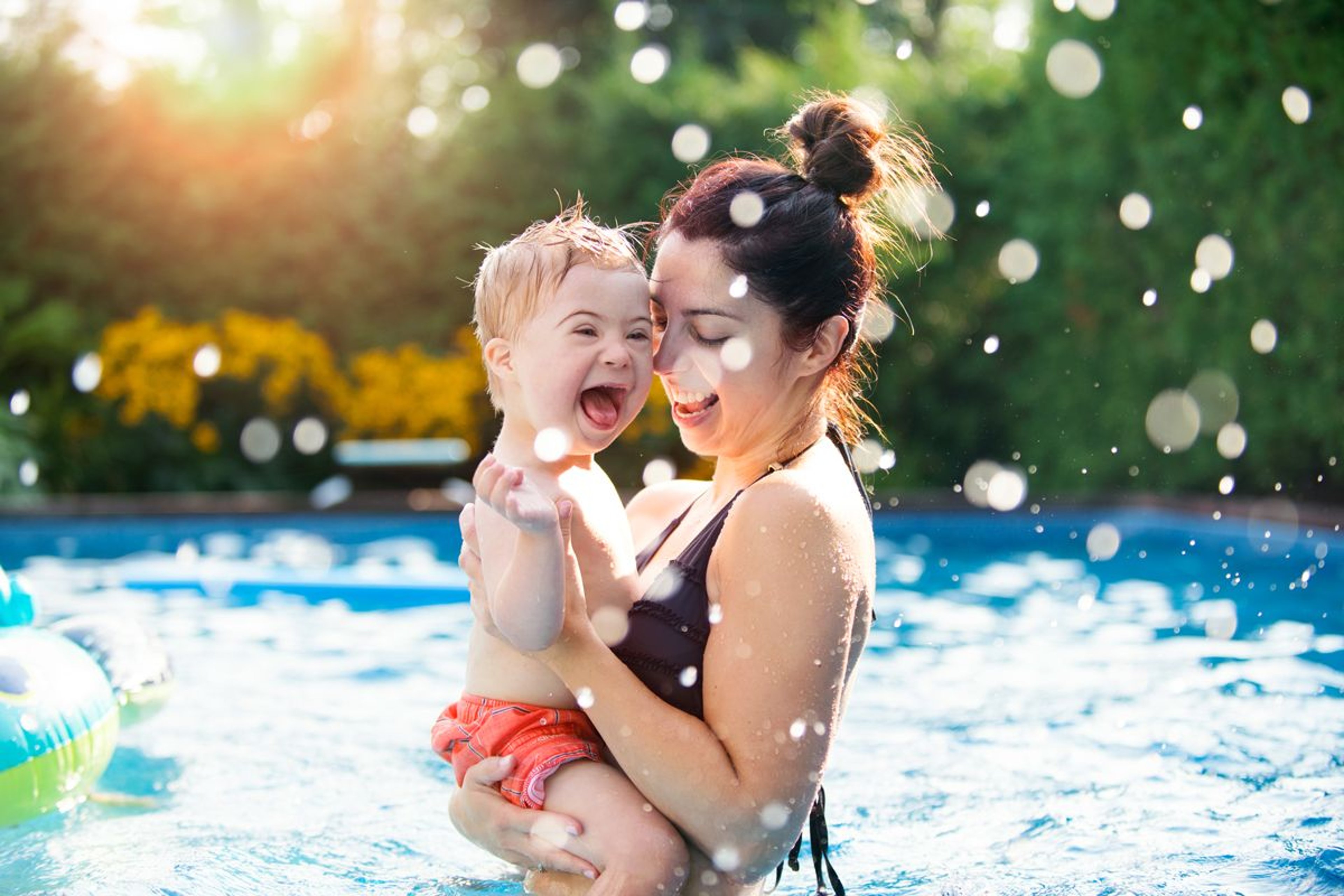 Mother and child bathing.