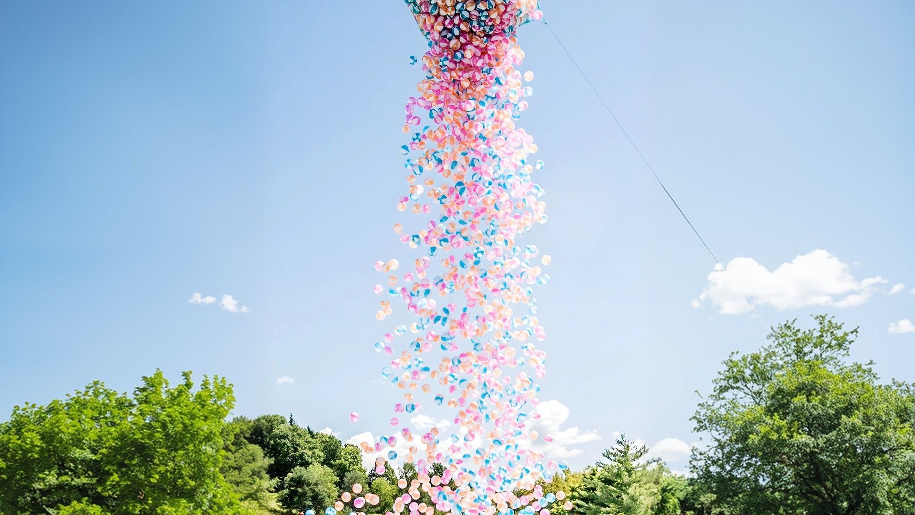 Water polo rain in the thermal spa resort of loipersdorf at the WeAreWater festival. 4,000 colorful beach balls fall from the sky.