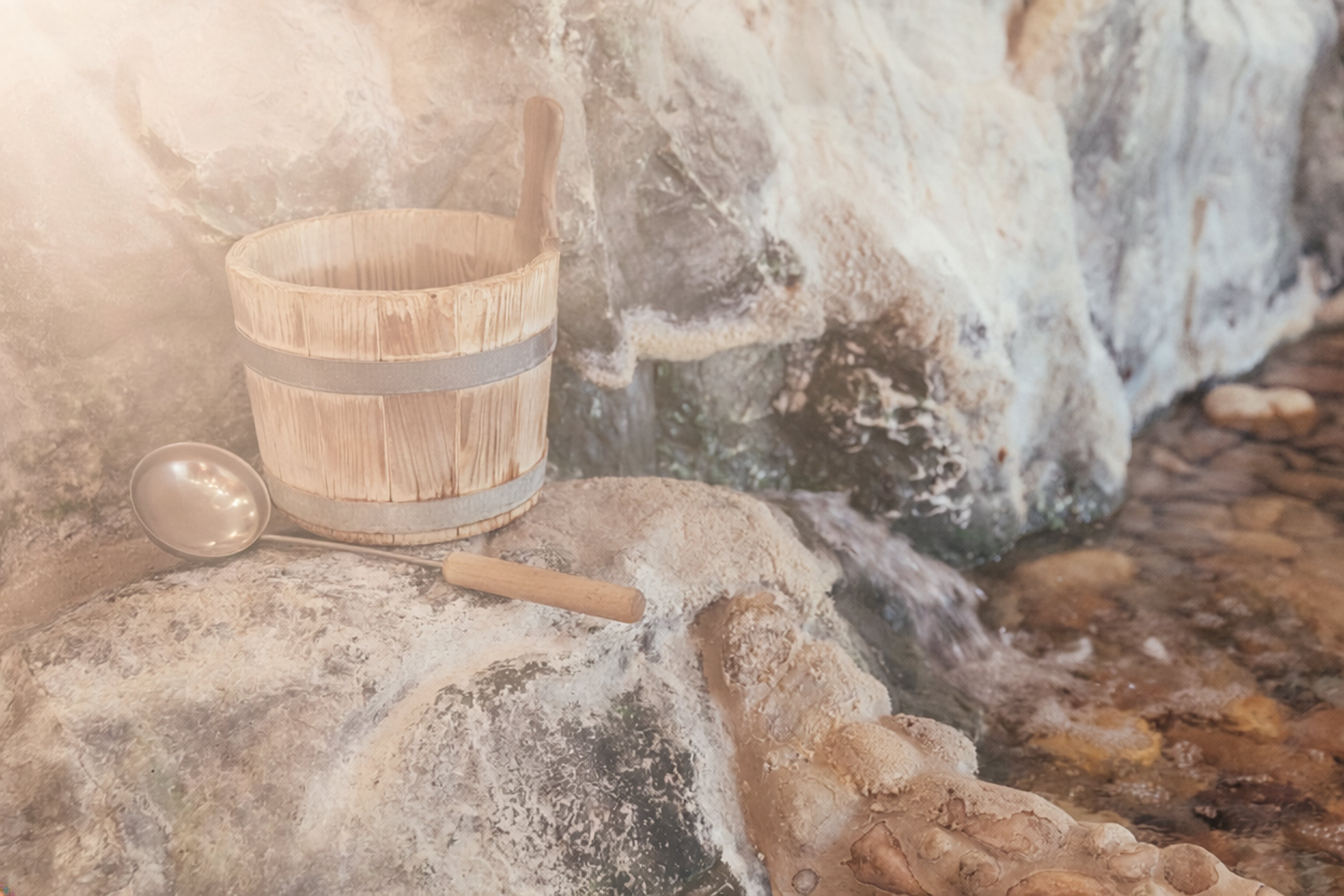A water bucket stands on a stone