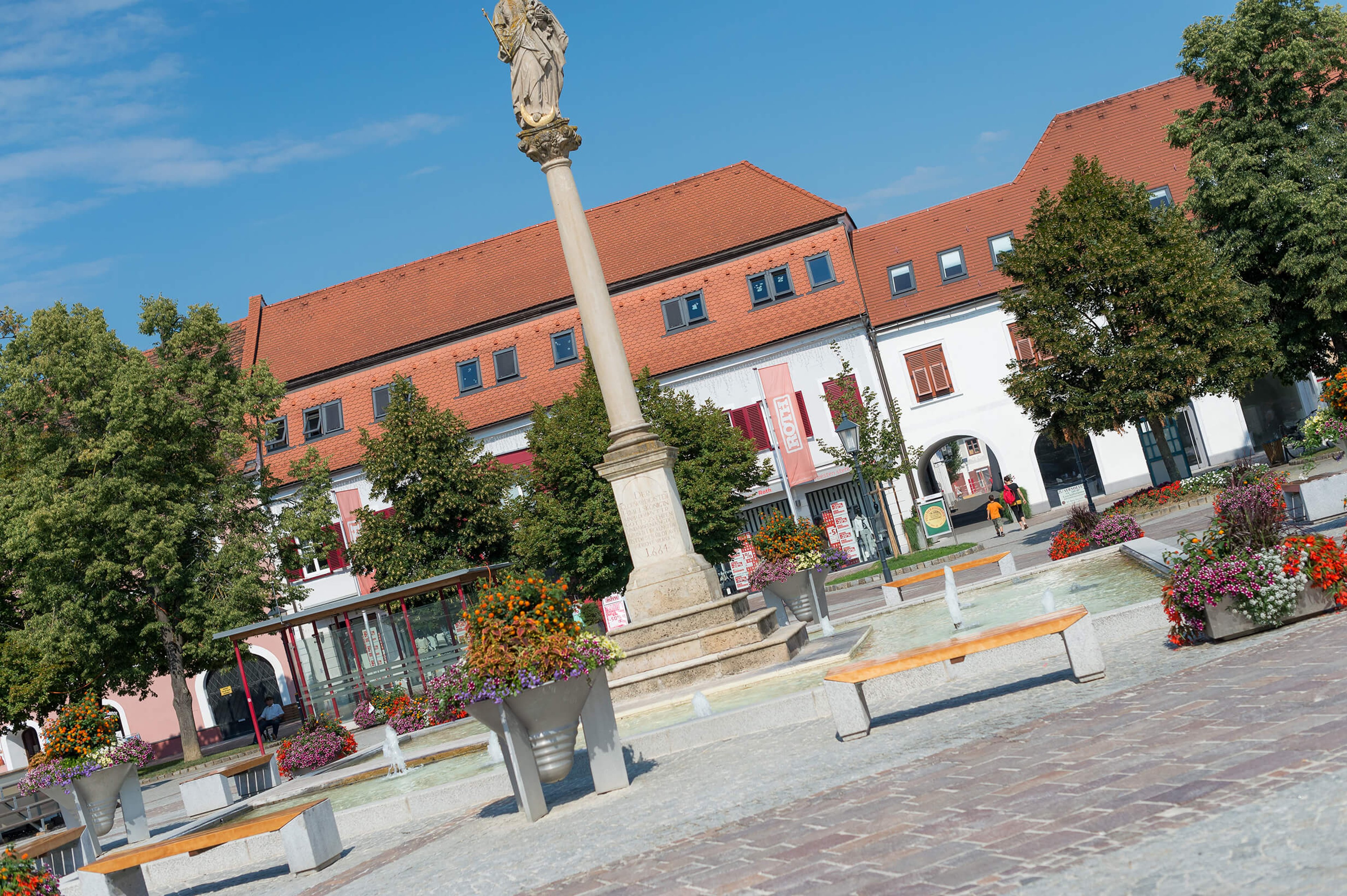 The main square in Fürstenfeld by day.