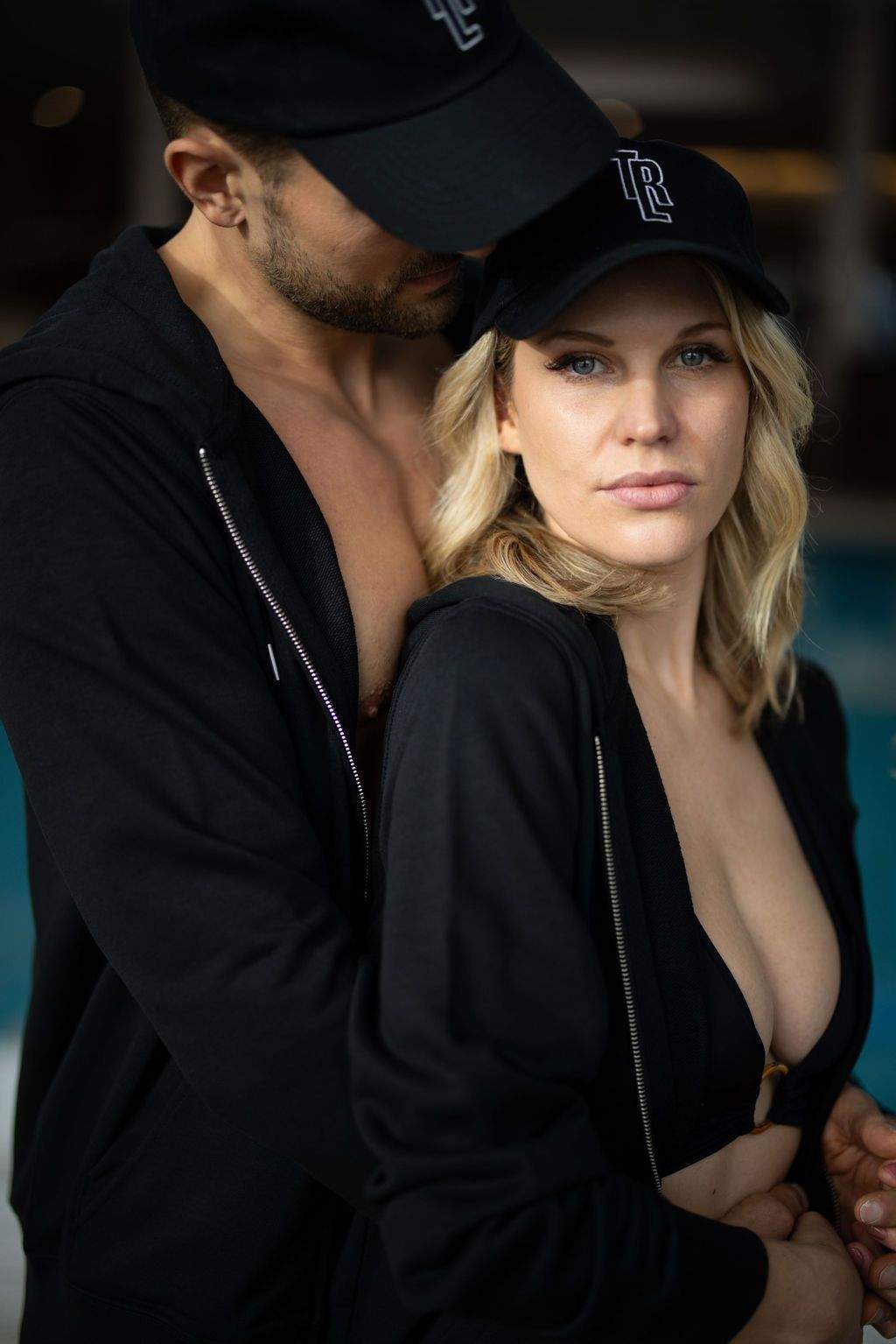 The couple proudly show off their matching black jackets with the Thermenresort Loipersdorf branding - stylish souvenirs reminiscent of unforgettable spa days together.