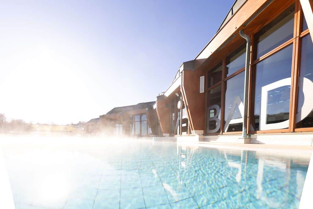 Outdoor spa area where the steam rises from the hot thermal water