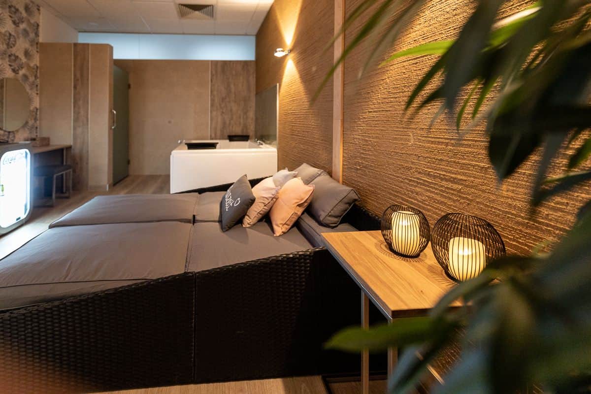 A cozy double bed in the private spa with whirlpool tub.