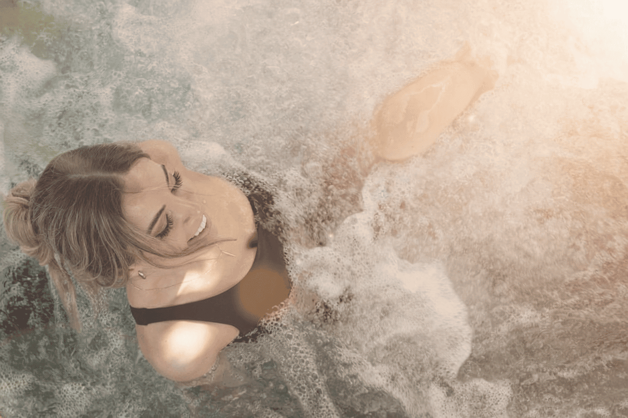 Woman sitting in a whirlpool