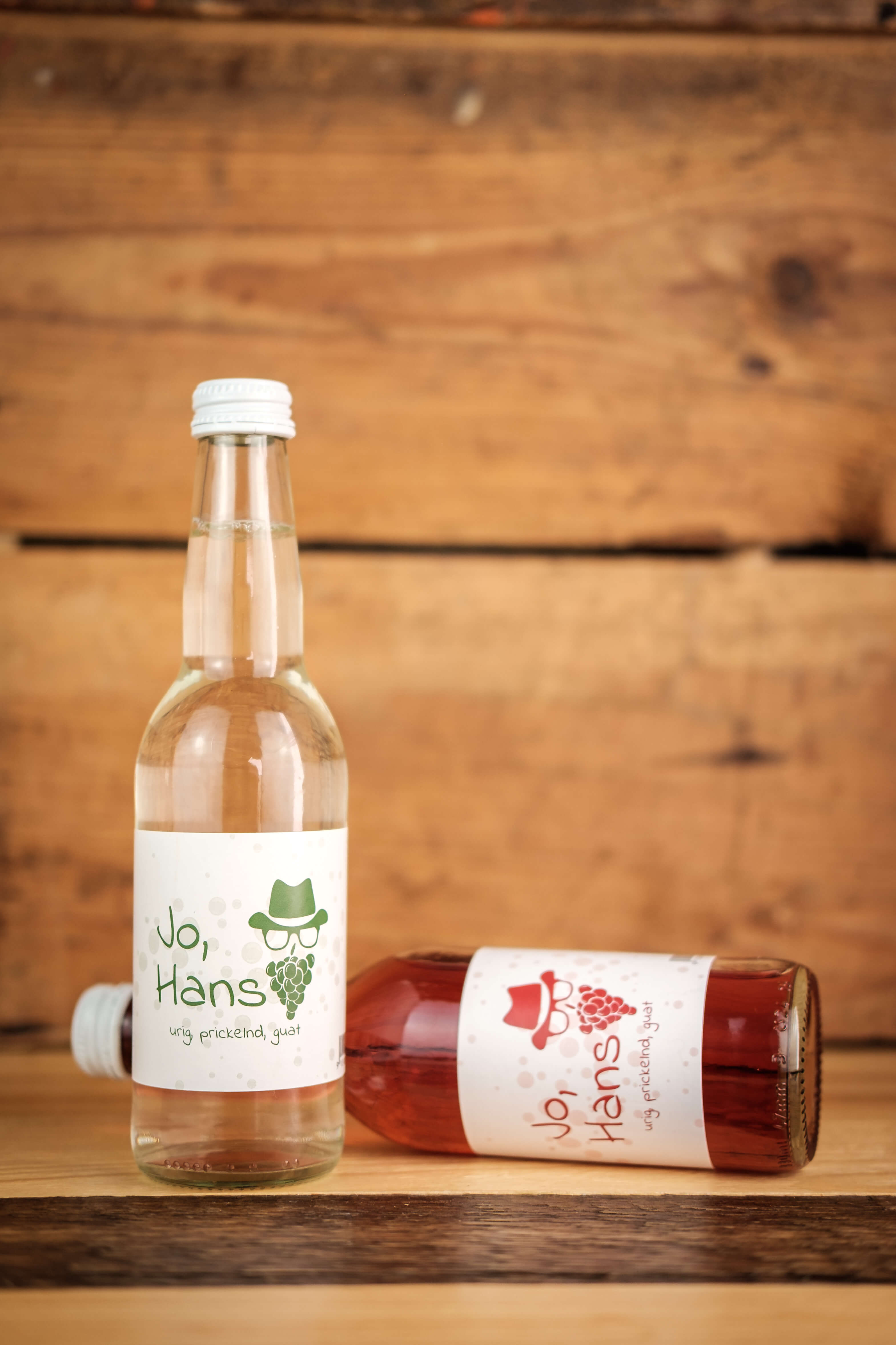 A bottle filled with red wine and white wine.